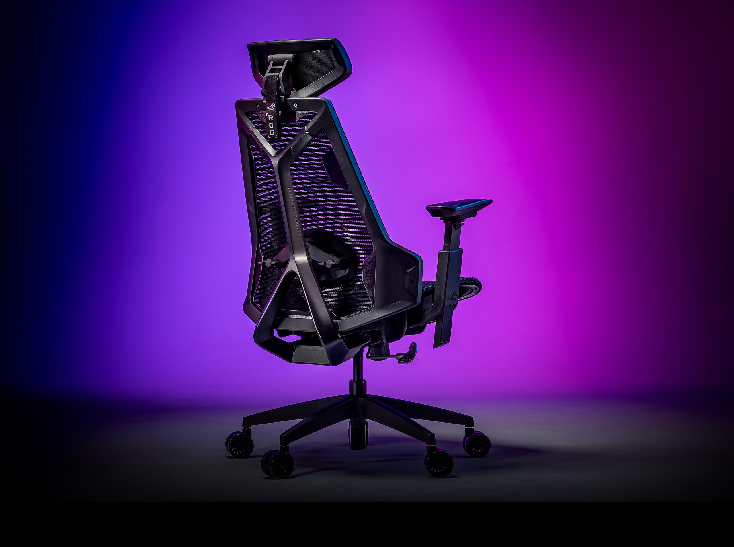 The rear view of ROG Destrier Core in the background of purple and blue color lighting.