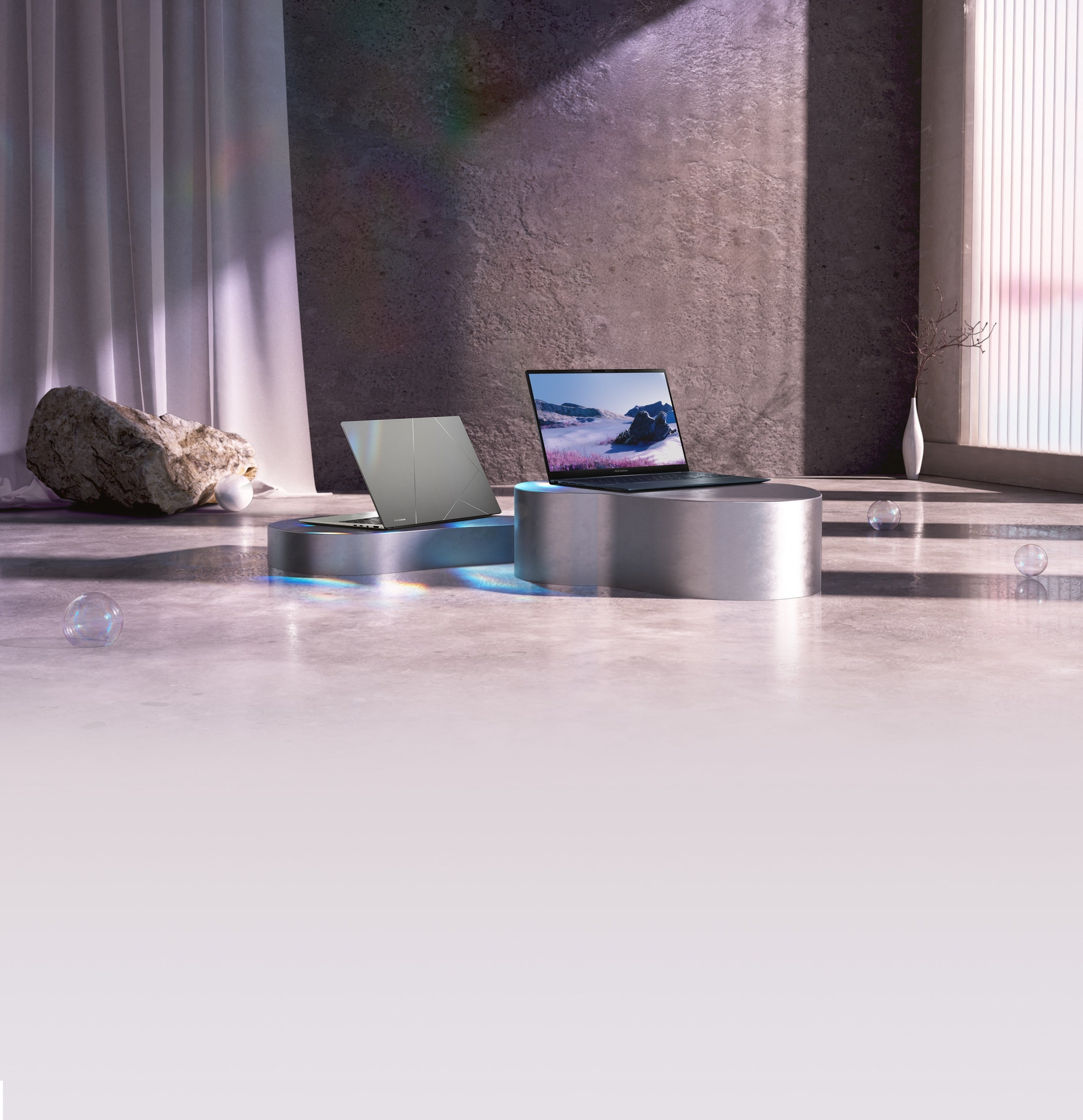 Two Zenbook 15 OLED laptops in Basalt Gray and Ponder Blue colors on metal podiums with dark a concrete wall and a curtain in the background.