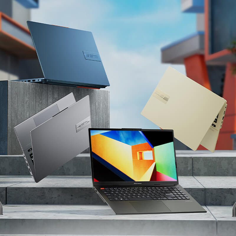 Four ASUS Vivobook S 14 OLED laptops in four colors standing on stairs with an urban background