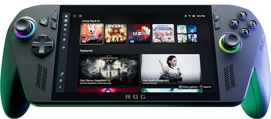 An ROG Xbox Ally X, propped up with the screen facing the camera, and the machine lit from below by a bright light.