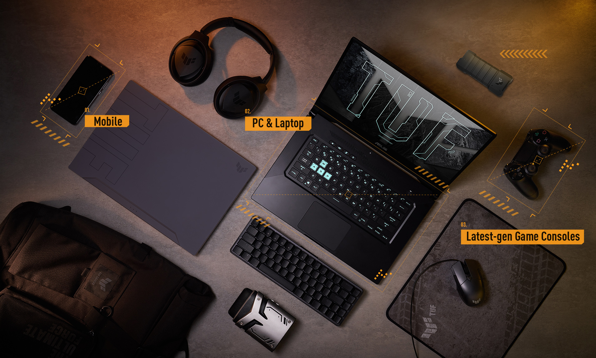 TUF Gaming product line up, including a laptop, a headset, a mouse and other peripherals.