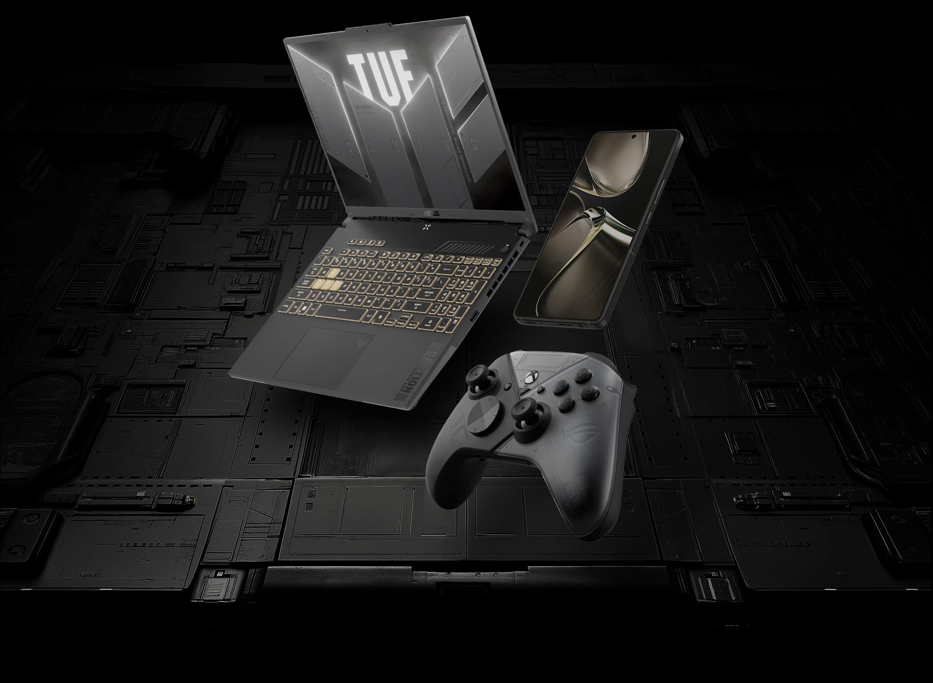 Il laptop gaming TUF, il telefono ROG e la console sono posizionati su una superficie scura con un motivo a circuiti.