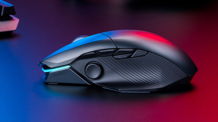 ROG Chakram X set on a surface, shone by blue and red lights