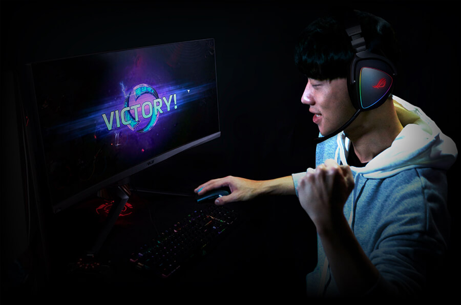 Person playing a computer game and celebrating victory