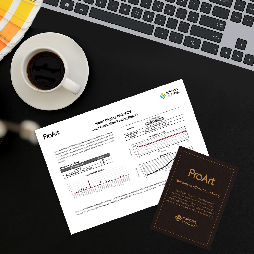 A color calibration test report of ProArt Display lies on a creator's desk