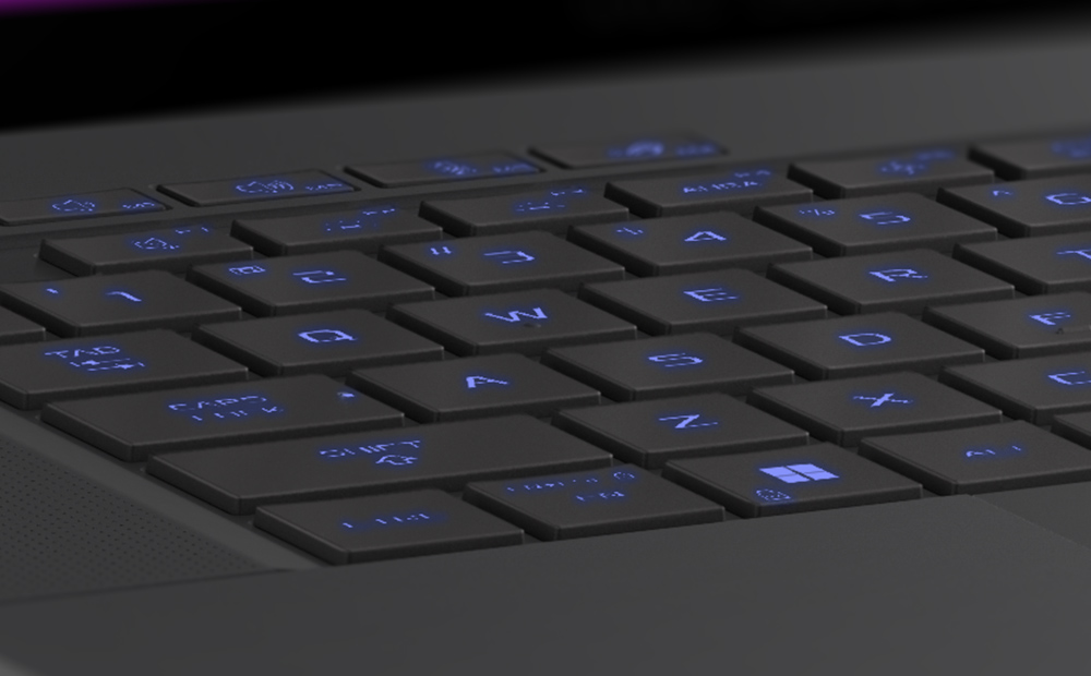 Gros plan sur les touches WASD du Zephyrus G16 Eclipse Grey, les touches étant éclairées en bleu.
