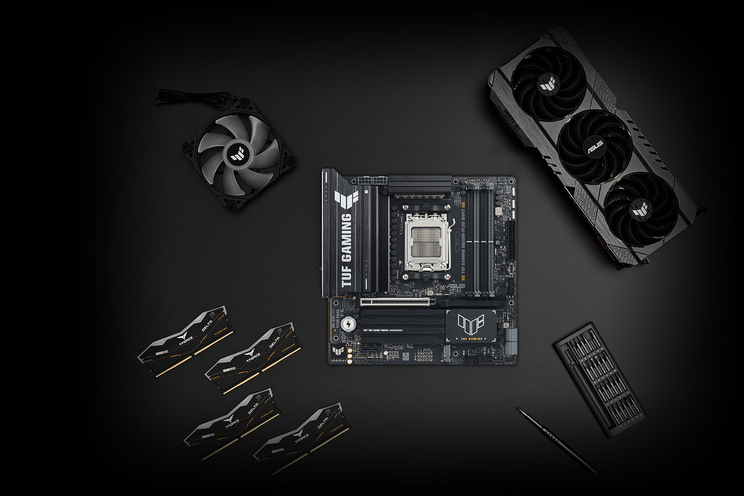 TUF GAMING B850M-PLUS WIFI7 motherboard placed on a metallic surface with various compatible PC components, including M.2 SSDs and memory modules, arranged neatly around it, representing the TUF Gaming Alliance for guaranteed build compatibility.