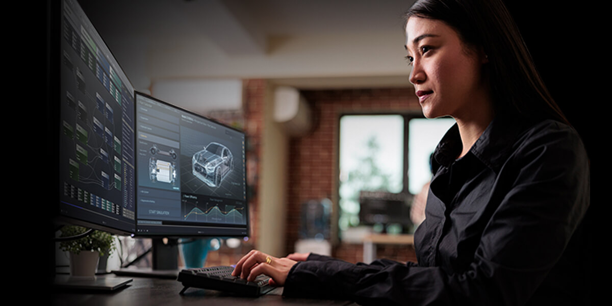 A person focused on a computer screen