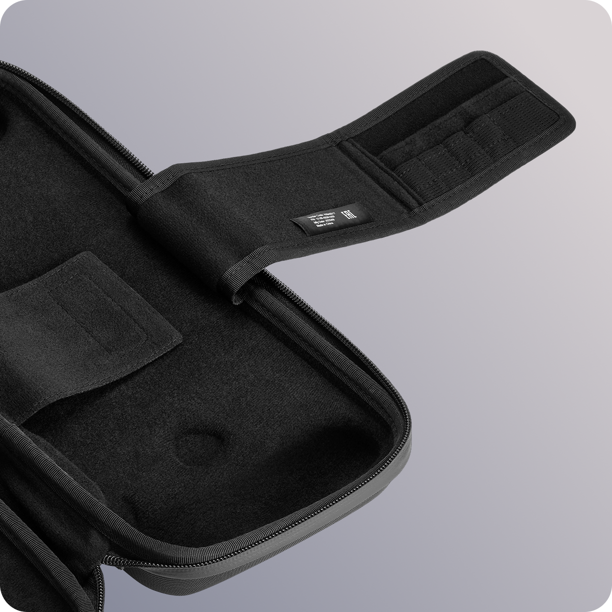 Showcasing the SD card storage built into the retention strap inside the case.