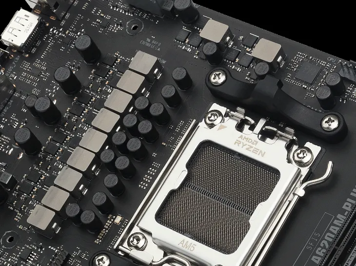 Close-up of an AM5 CPU socket on TUF GAMING A620AM-PLUS.