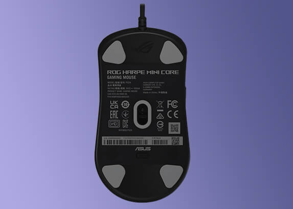 Bottom view of the ROG Harpe Mini Core mouse, with its four pieces of mouse feet highlighted