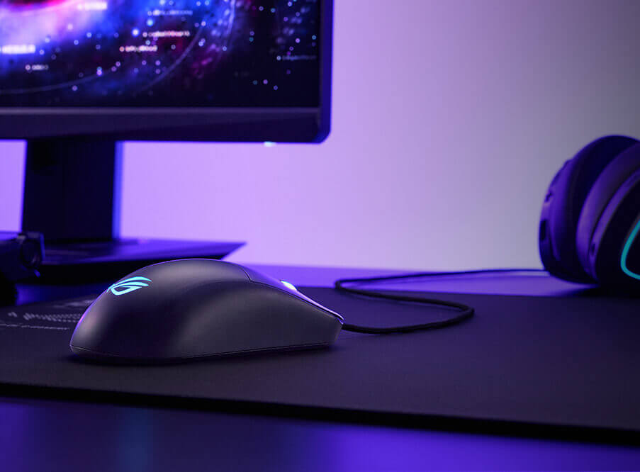 A view of the Harpe Mini Core mouse from behind, placed on a mousepad