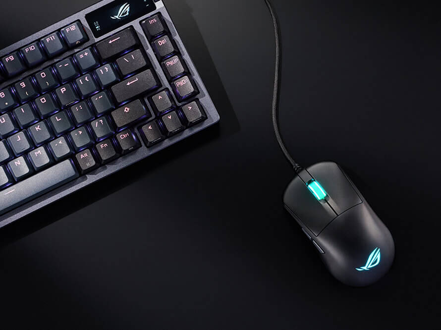  A top view of the ROG Harpe Mini Core mouse, placed next to the Azoth Keyboard