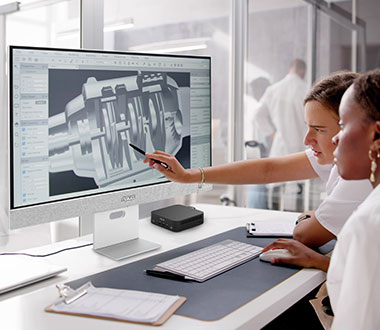 ASUS ExpertCenter PN54-S1 Mini PC Best Mini PC for business on white desk with white monitor showing mechanics of a device