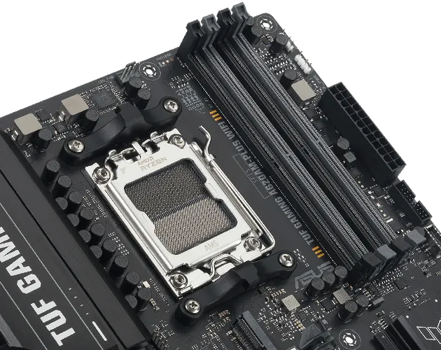 Close-up of TUF GAMING A620AM-PLUS WIFI showing DDR5 memory slots with a label indicating support for DDR5 modules up to 8000+ MHz.