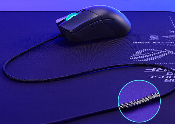 The ROG Gladius III placed on a Sheath II XXL mouse pad and a highlight on its paracord