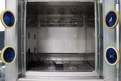 NUC Mini PC Temperature Test NUC best quality mini PC testing of temperature test. A small black NUC mini PC placed inside an environment that resembles an oven.