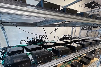 NUC Mini PC demonstrated MTBF Test NUC best quality mini PC testing of demonstrated MTBF test. A row of ASUS computer units are arranged on shelves.