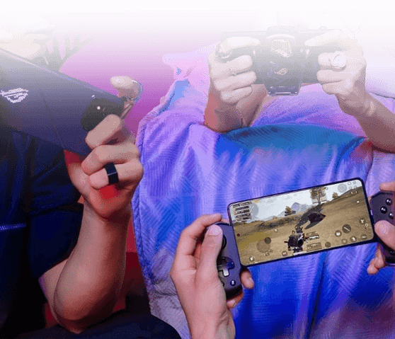 People gaming on ROG Phone with cooler attachment and handheld console showing action game on screen