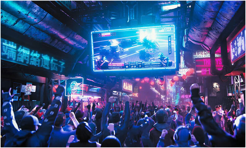 A crowd watching a live broadcast of a battle