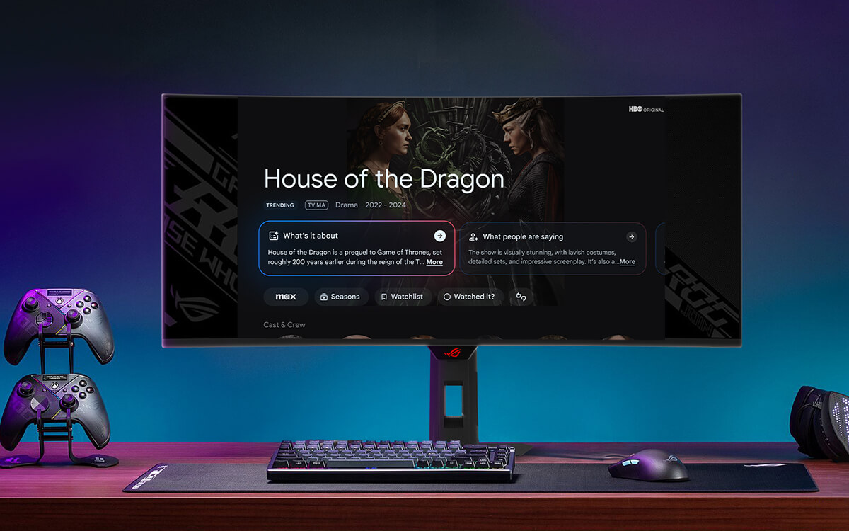 A gaming setup with ROG gaming monitor displaying the Google TV AI overview interface