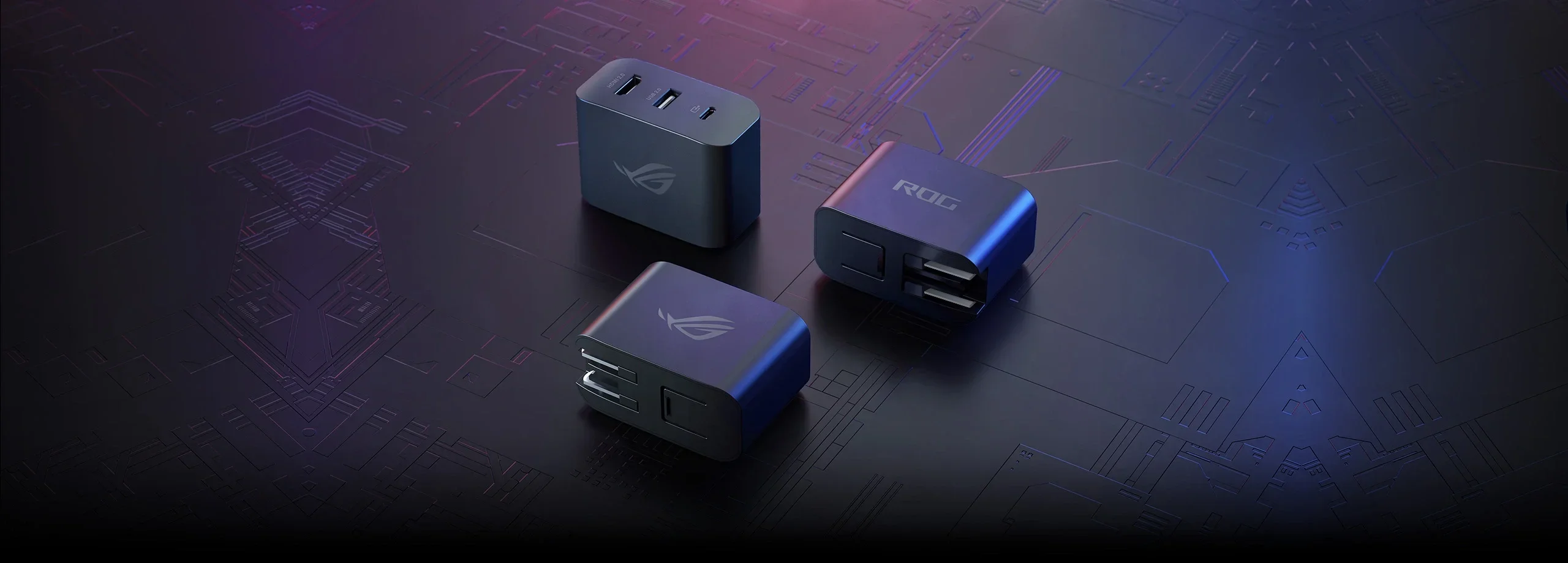 Three ROG Gaming Charger Docks, one with the ports visible, and the other two with the lettering “ROG” and the ROG logo visible, respectively.