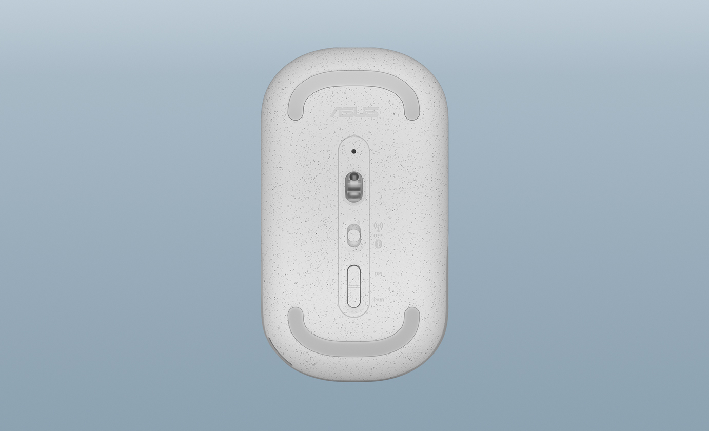 An underside view of an ASUS Marshmallow Mouse MD100 finished in Quiet Blue, showing the DPI and dual-mode switches.