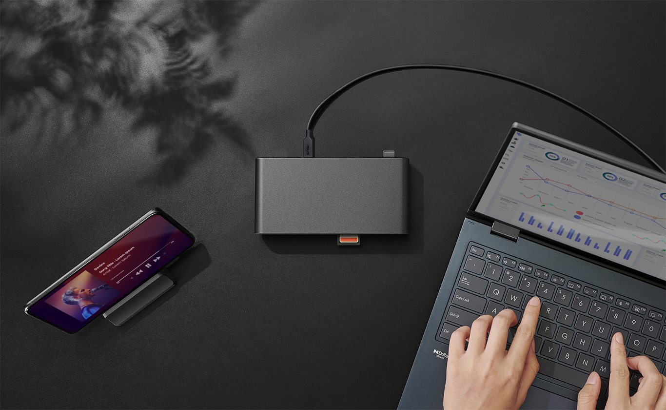 A dock connected to a laptop and a cellphone.