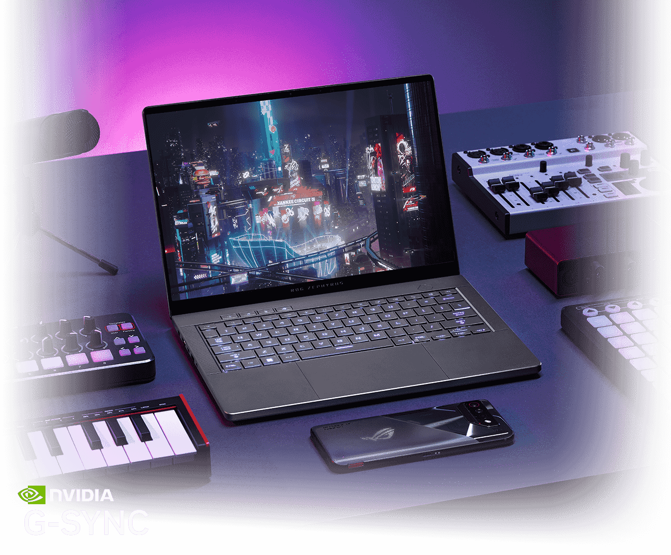 An ROG Zephyrus G14 sits on a table with the lid open and a cyberpunk scene on screen, flanked by digital music production equipment, an ROG Phone, an ROG Carnyx microphone, and an ROG headset.