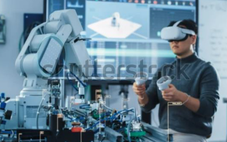 Computer Science Engineer in Virtual Reality Headset Using Controllers and Operating Robot Arm Under his Control.