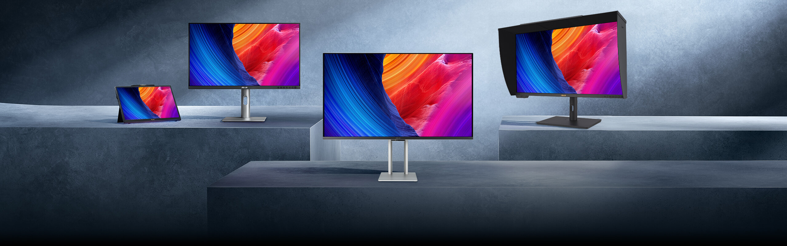 Three ProArt monitors on podiums