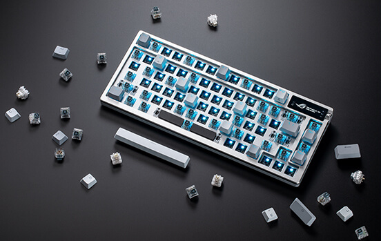 ROG Azoth Moonlight White with most key switches removed, showing the hot-swappable feature
