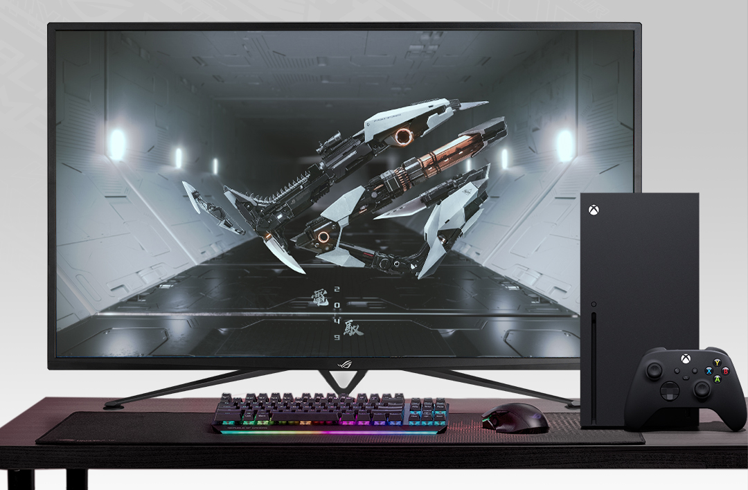 An ROG Strix XG43UQ Xbox Edition is shown with with one keyboard, one mousepad, one Xbox and a console controller