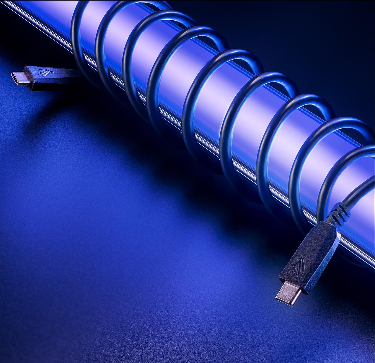 The included USB-C cable is wrapped approximately 10 times around a shiny metal pole.
