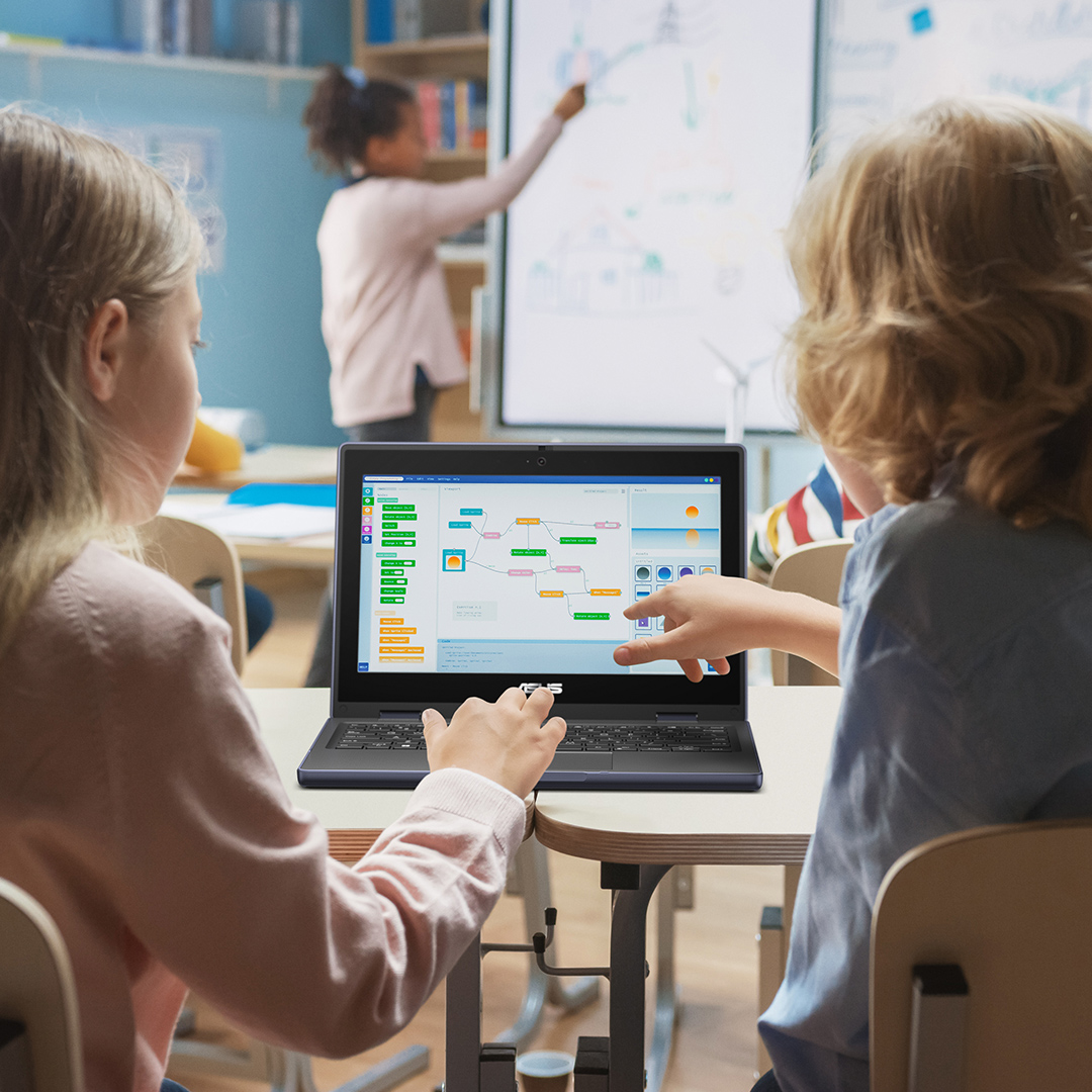 A boy is recording a teacher doing experiment by ASUS BR1100F laptop in tablet mode.