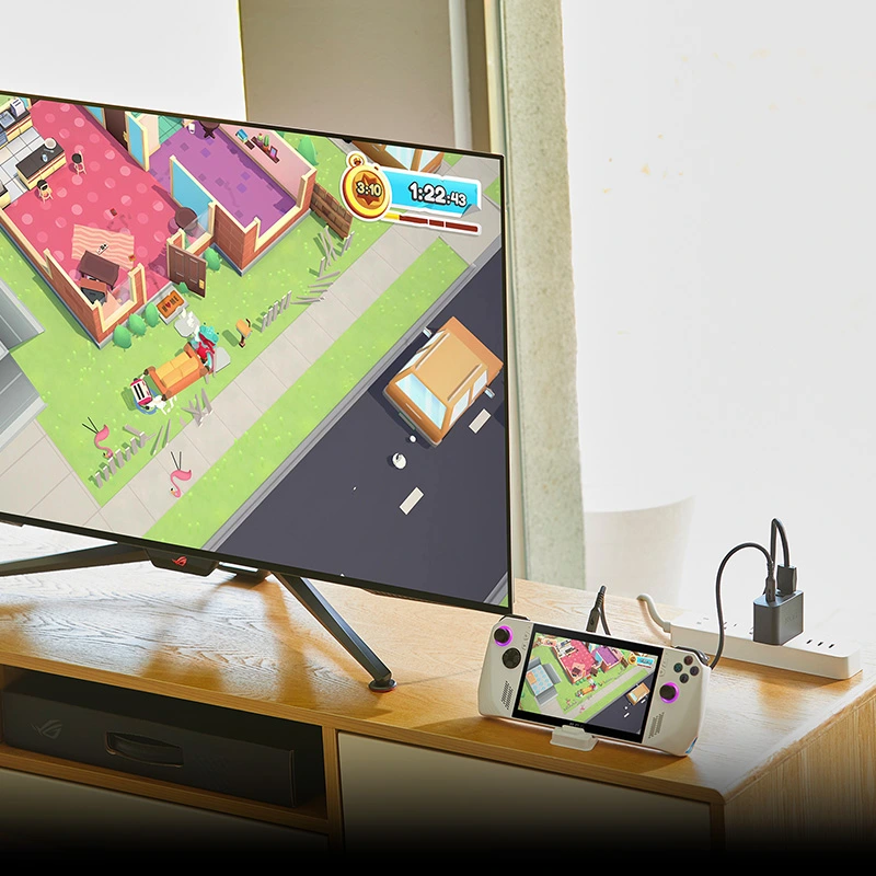 ROG Ally w systemie rozrywki, podłączony do ROG Gaming Charger Dock i dużego telewizora.