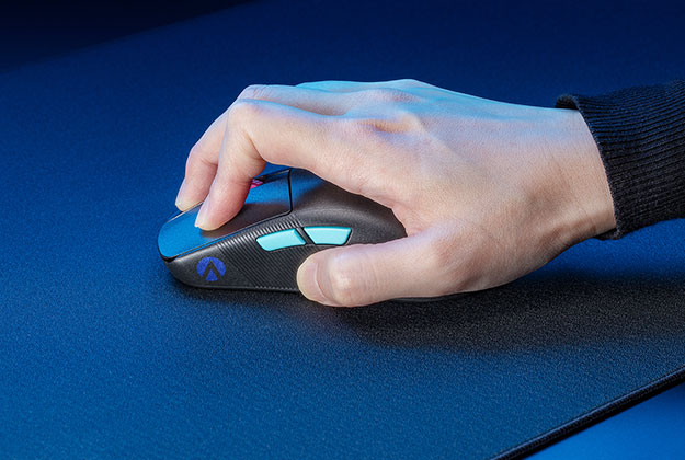 A hand gripping firmly onto a mouse, and pressing into the surface of the ROG Hone Ace XXL