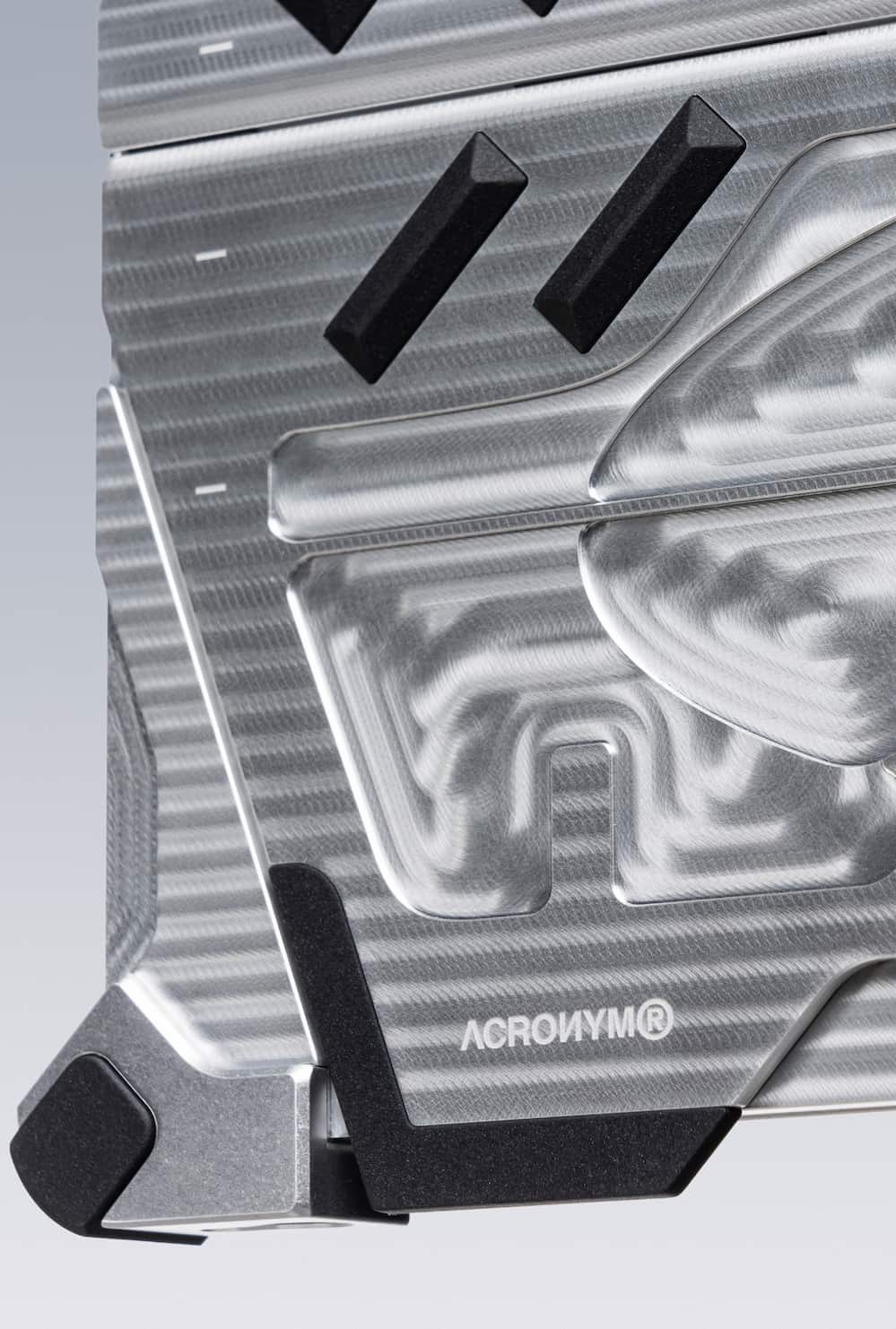 Close-up shot of the left bottom bumper and exposed aluminum.