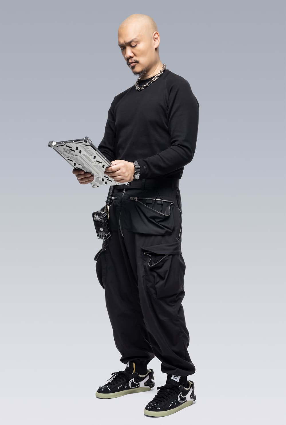 ACRNM creative director Errolson holding the RMT02 in vertical tablet mode.