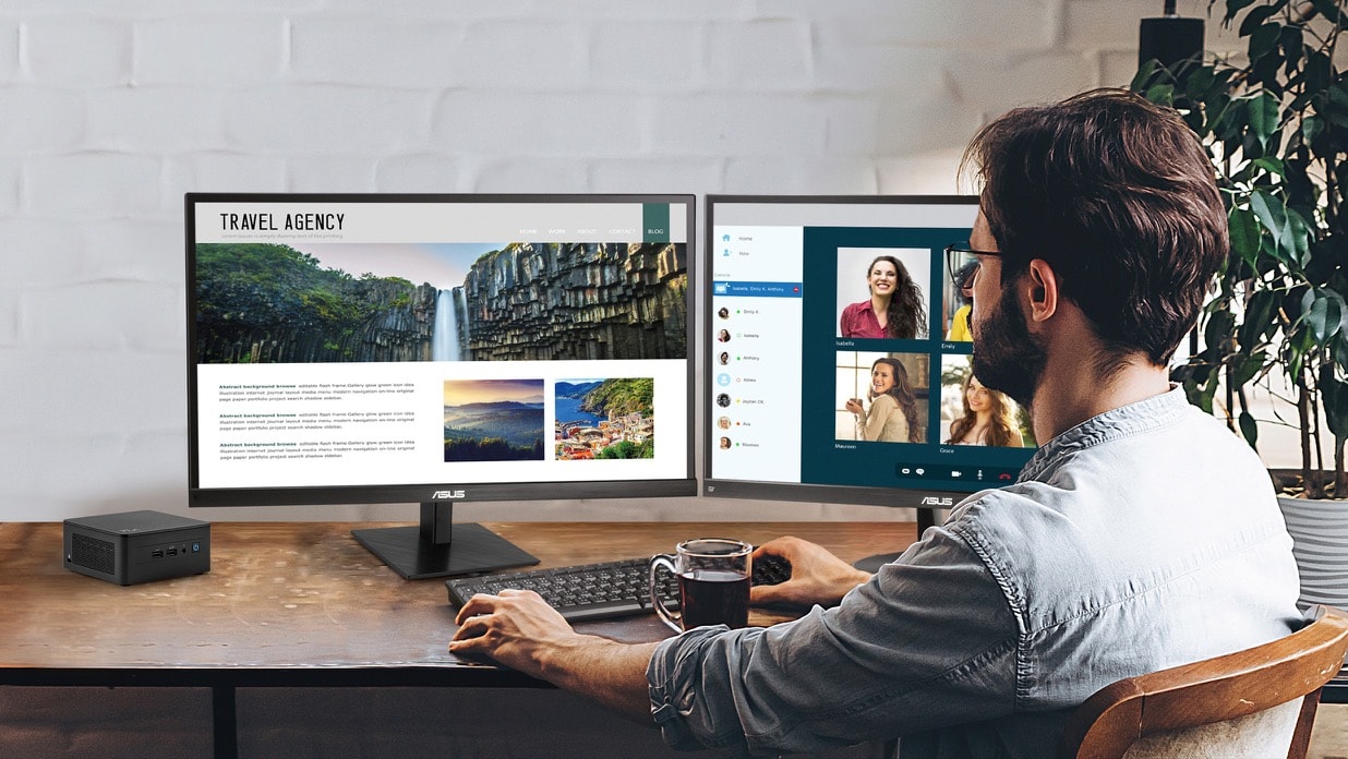 A man is sitting at desk working with two monitors powered by NUC mini PC. 