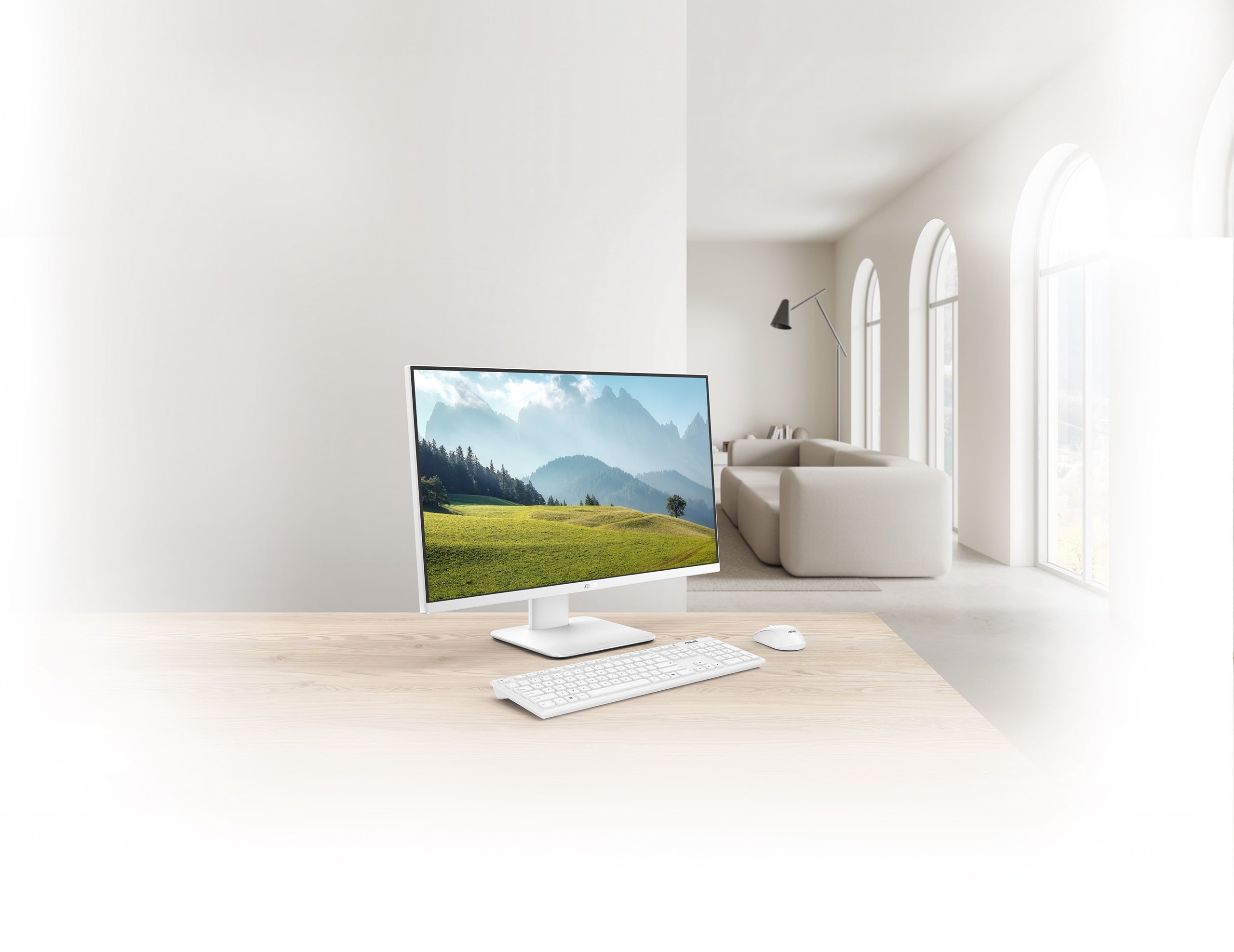 An ASUS V400 AiO, accompanied by a keyboard and mouse, is shown on the wooden desk with a living room in the background.