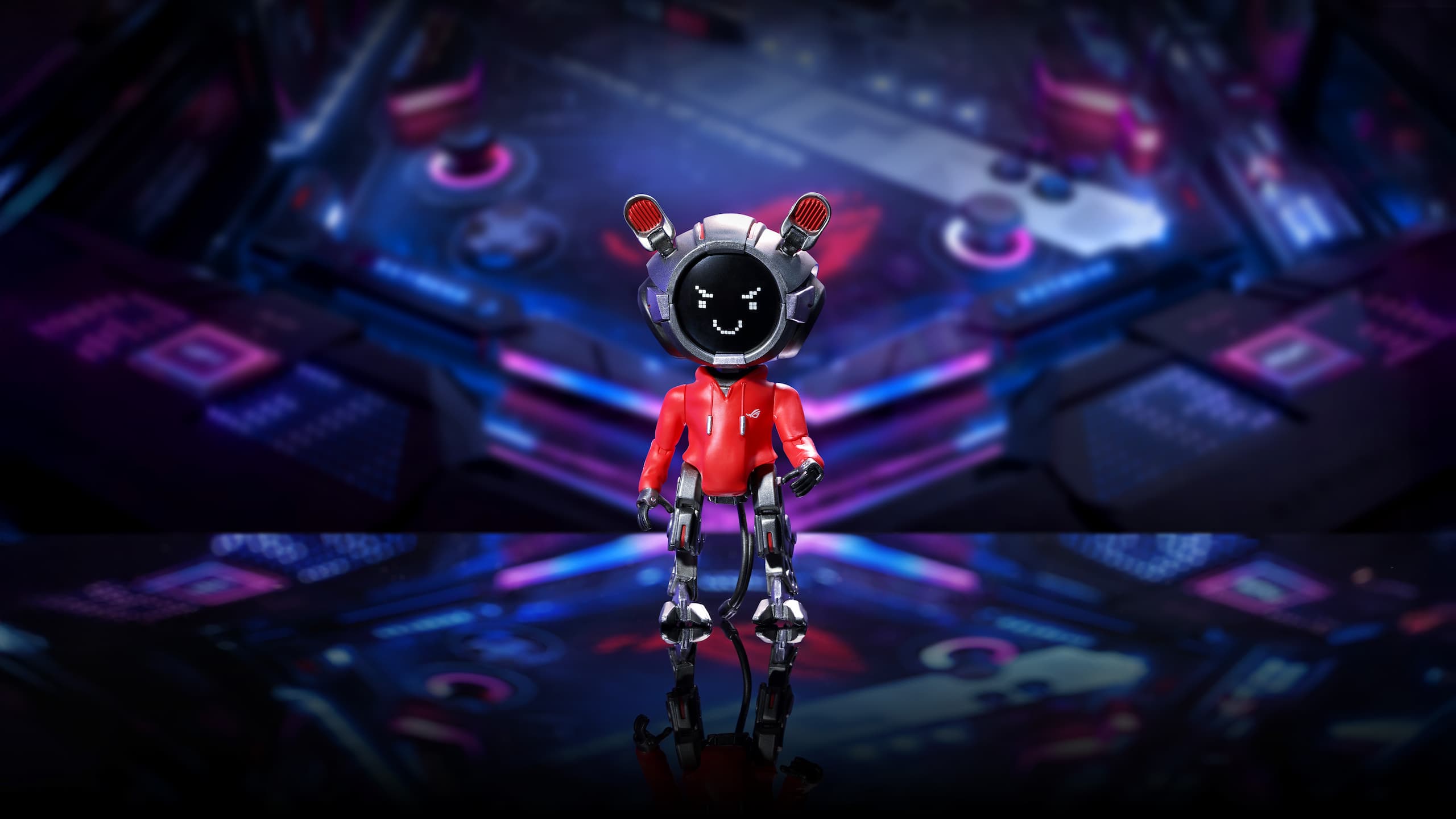 "ROG OMNI Model OG — limited-edition 10cm collectible action figure — showcases in the ROG universe. OMNI figure appears in a bold black and red colorway, wearing a signature ROG red hoodie, with pixelated expressive face display and metallic limbs. Background features a cyber-inspired gaming environment with neon blue and purple highlights. Text on image reads “ROG OMNI MODEL OG” and tagline “FOR THOSE WHO DARE — IN POCKET SIZE.&rdquo Description introduces OMNI OG as the ultimate desk companion and tactical support bot, embodying personality, performance, and attitude in a premium figure collectible."