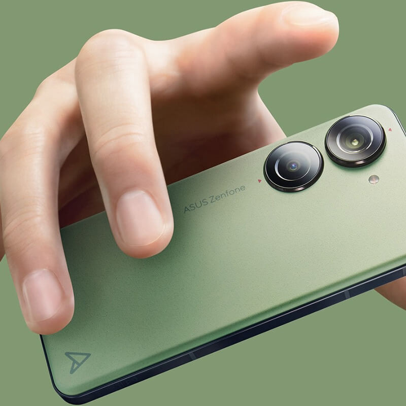 A hand holds a green Zenfone 10, with 'Zenfone 10' and the slogan 'MIGHTY ON HAND' written beside it.