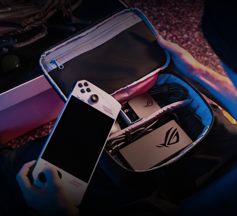 A person opens the ROG Archer Tech Pouch containing a portable gaming device.