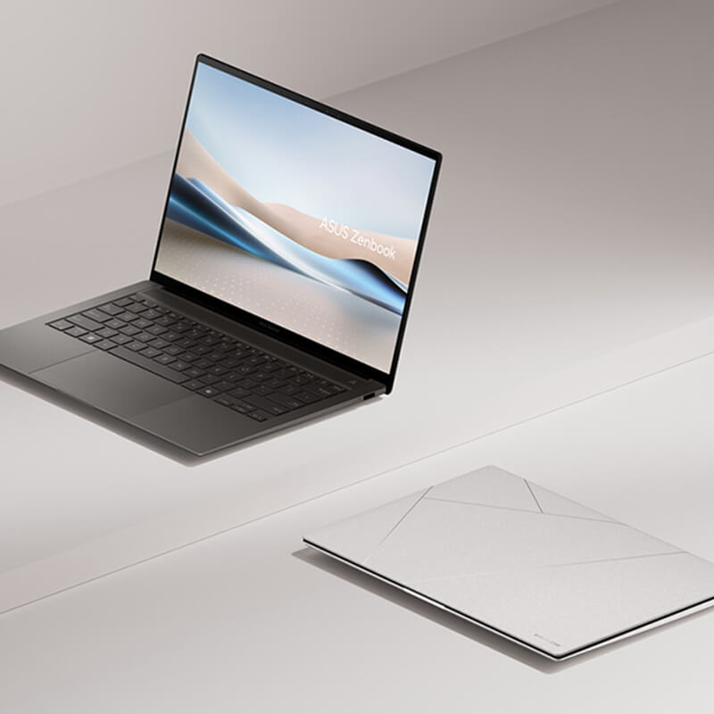 Two Zenbook S 14 laptops are shown – one is open at 100 degrees and viewed from the left front, and the other is closed and placed on the ground.