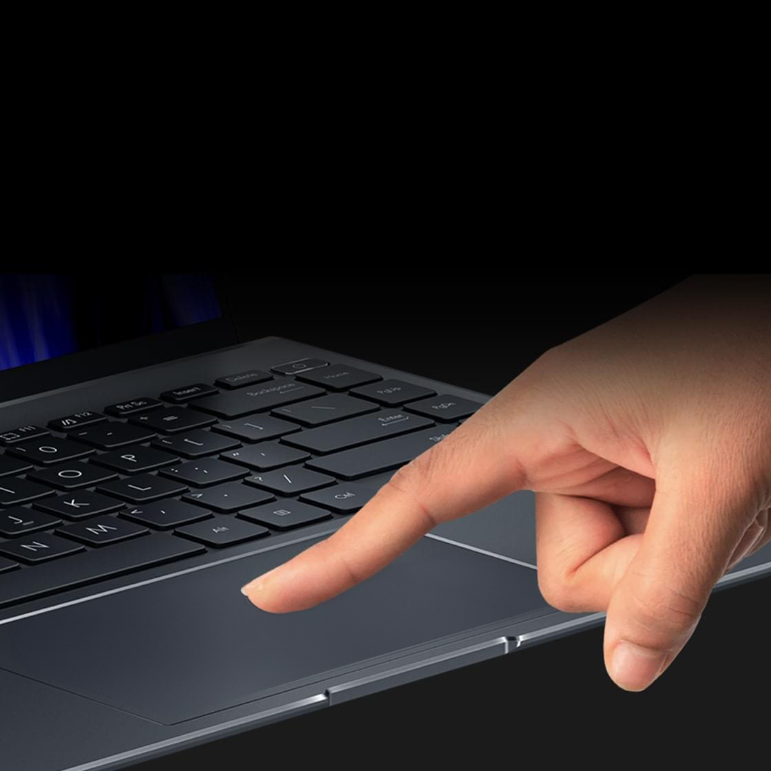 A finger scrolls on the ultra-smooth surface of the ErgoSense touchpad.