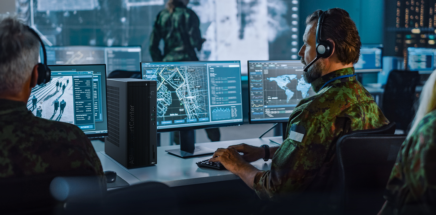 In the military surveillance center, a service member is working with an ASUS ExpertCenter desktop computer