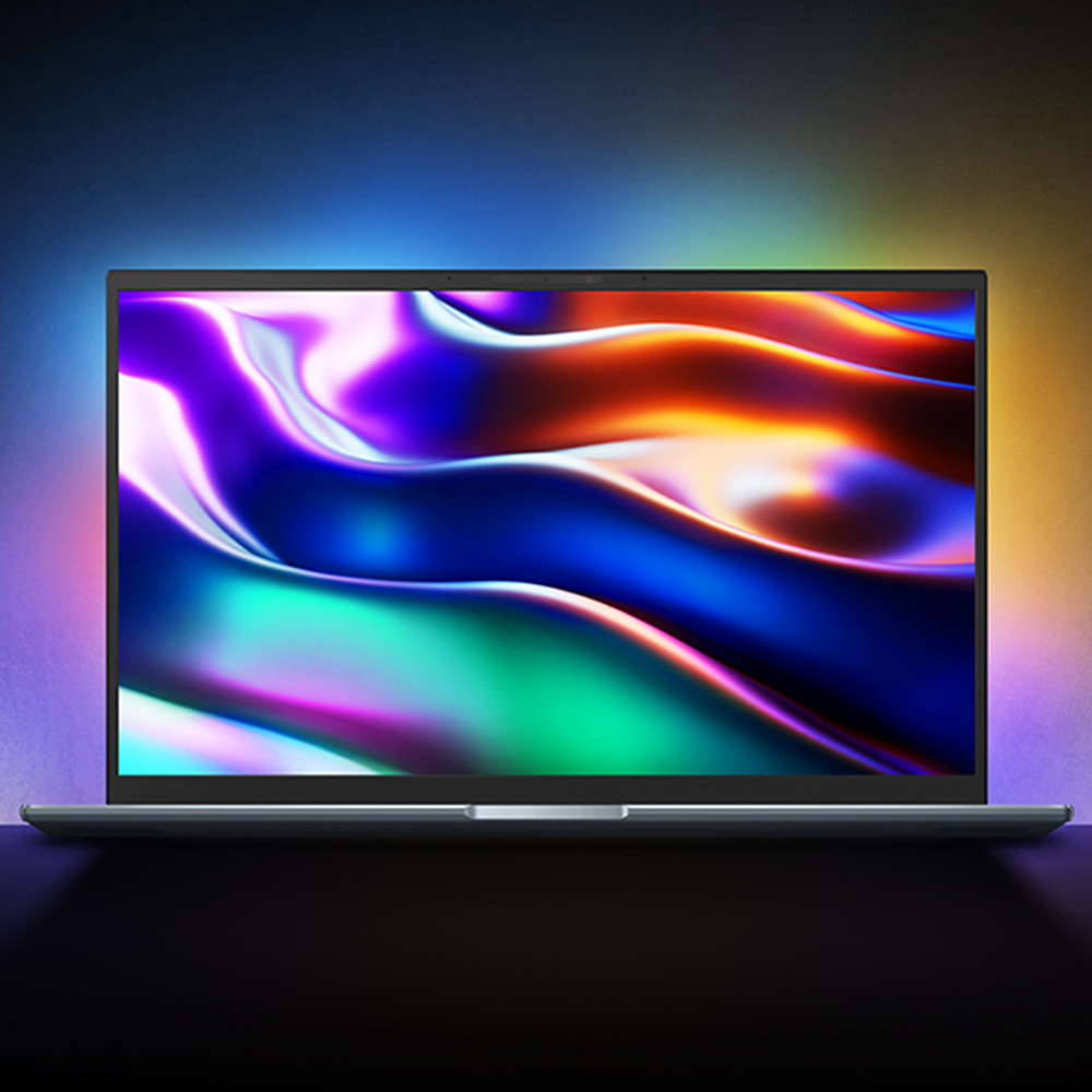 An ASUS laptop with ASUS Lumina OLED screen displaying colorful, detailed wallpaper