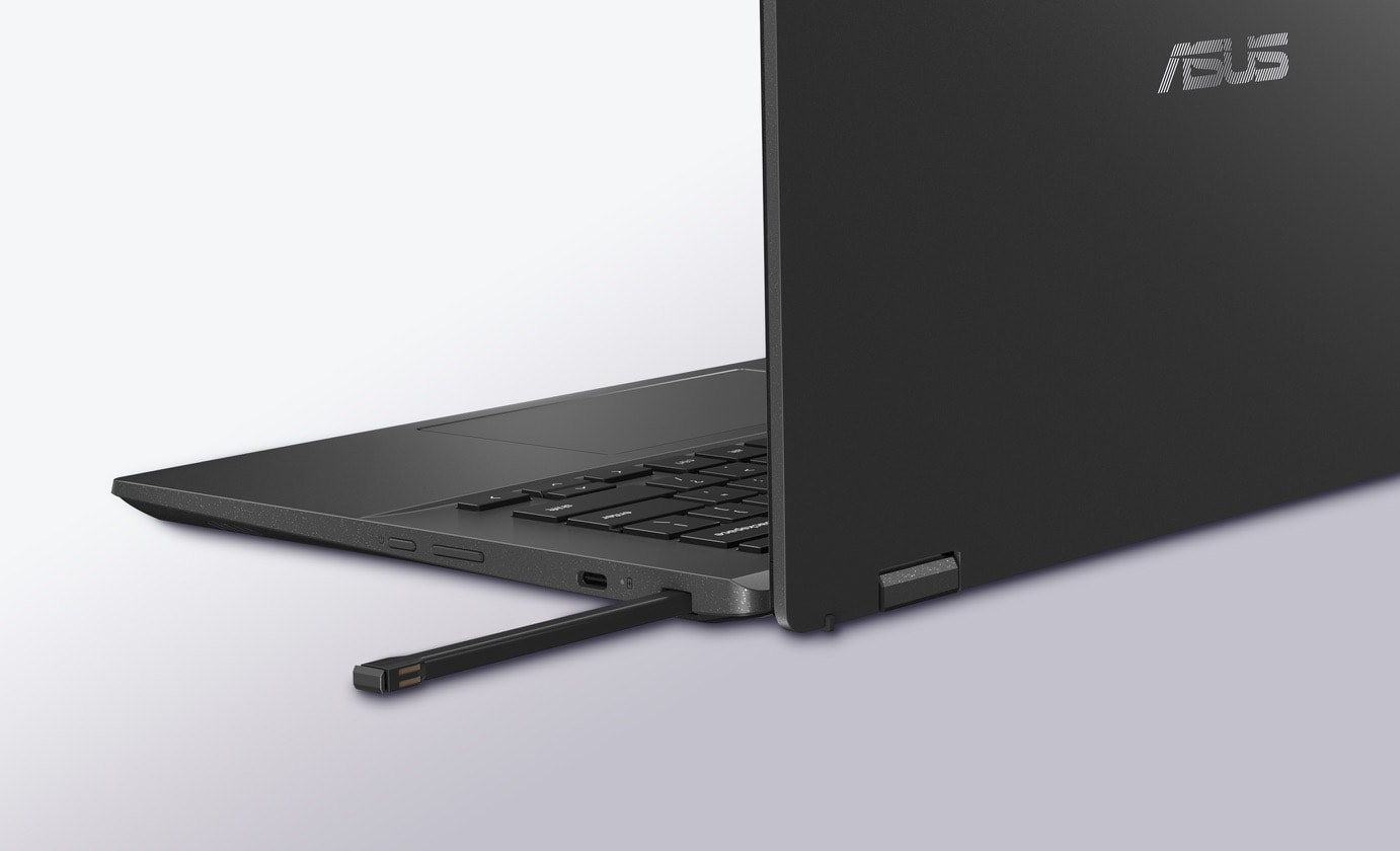 An angled rear view of an ASUS Chromebook CM14 Flip in laptop mode with a stylus half inserted in the garage. 