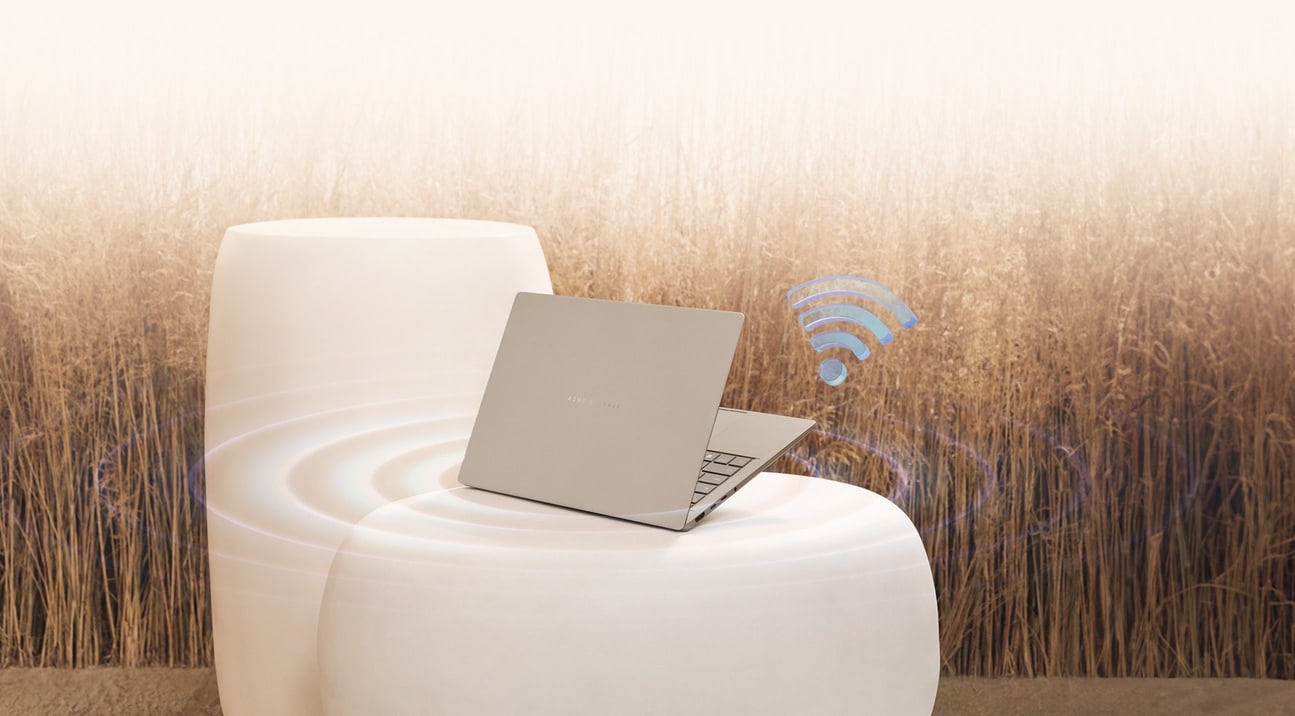 The laptop is placed on a white ceramic chair surrounded with a blue Wi-Fi icon floating by its side.